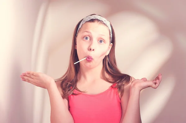 Funny teen girl eating lollypop — Stock Photo, Image