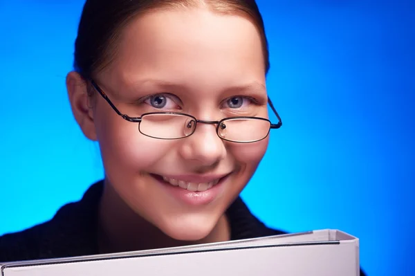 Young businesswoman in eyeglasses holds folder and smiling — Stock Photo, Image