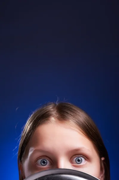 Teen girl hiding her face behind colander — Stock Photo, Image