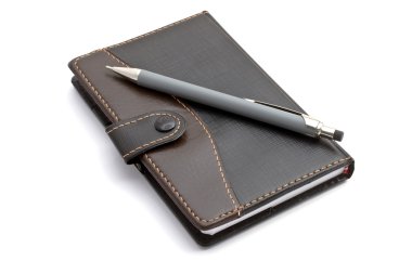 siyah notebook ve mekanik kurşun kalem
