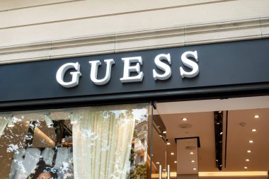 Barcelona, Spain - May 9, 2022: Guess store sign. Guess is an American clothing brand and retailer