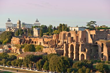 View of Circus maximus and Vittorio emanuele monument at sunset clipart