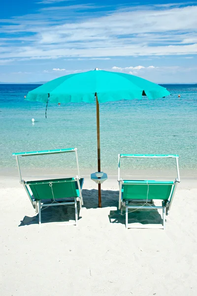 Two beach chairs with green umbrella. — Stock Photo, Image