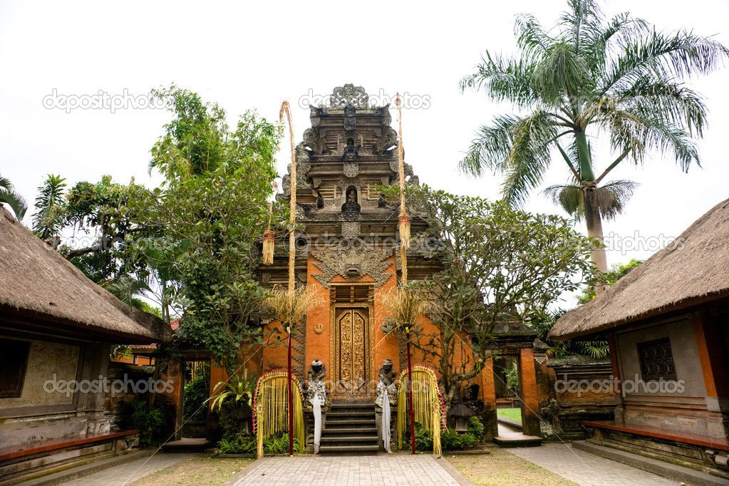 Balinese Temple entrance in Ubud, Bali, Indonesia. Isolated on w