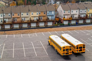 Schoolbuses in a parking, Atlanta, Georgia, USA. clipart