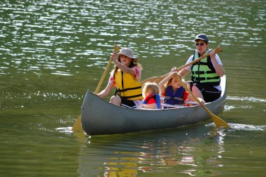 Family Canoeing at Lake clipart