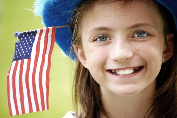 Smiling Girl with Flag Royalty Free Stock Images