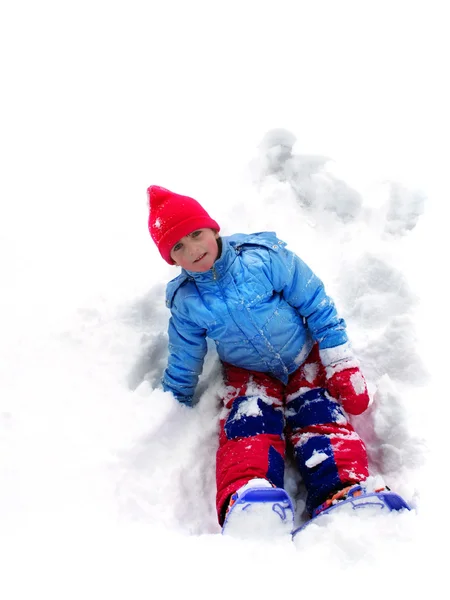 Criança brincando na neve — Fotografia de Stock