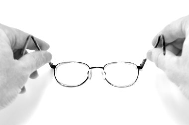 Holding Eyeglasses Looking Through Lenses clipart