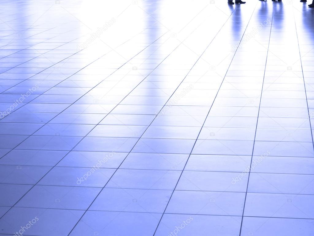 People walking on White Reflective Floor