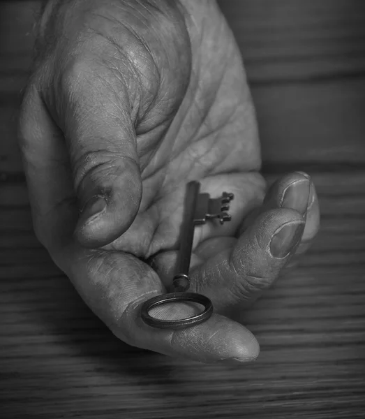 Hand Holding Old Key Giving Away — Stock Photo, Image