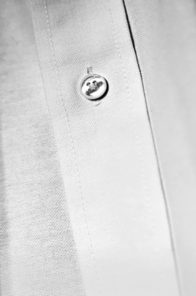 Bouton de chemise robe blanche — Photo