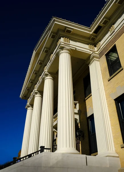 Detail of old courthouse court house building with columns nd architecture and blue sky