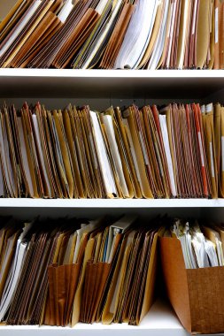 Detail of files for work or business on shelves and folders to be organized or organization