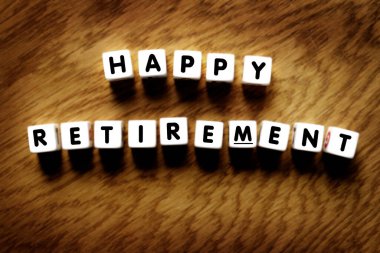 Happy Retirement spelled out representing reaching financial independence and freedom of time sign for celebration