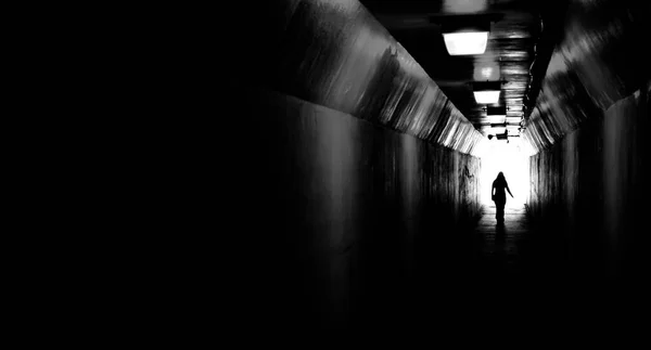 Person Walking Tunnel Light End Accomplishing Goal Leaving Darkness — Stock Photo, Image