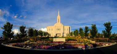 Pocatello Idaho LDS Mormon Latter-day Saint Temple with sky clouds flowers and trees