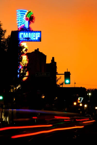 Downtown in a busy city car lights blur speed long exposure Chief Theater sign Pocatello