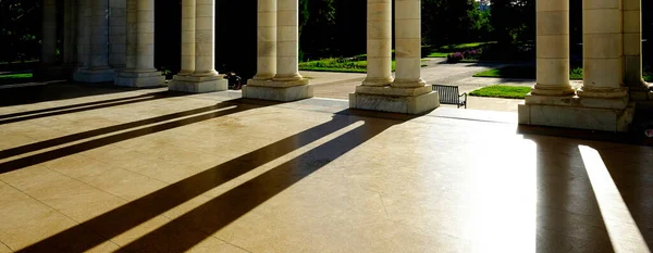 Columns of marble on a building pavilion showing architecture design and decorative structure with light and shadows