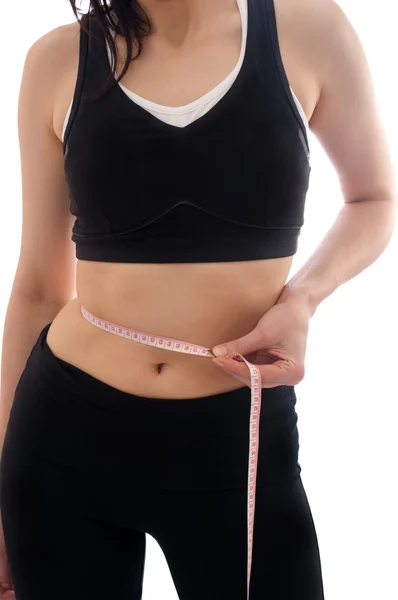 Young woman with measure tape — Stock Photo, Image