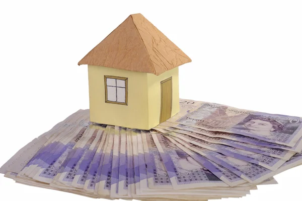 House and stack of money — Stock Photo, Image