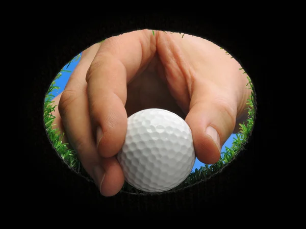 Mano che tiene la palla da golf — Foto Stock