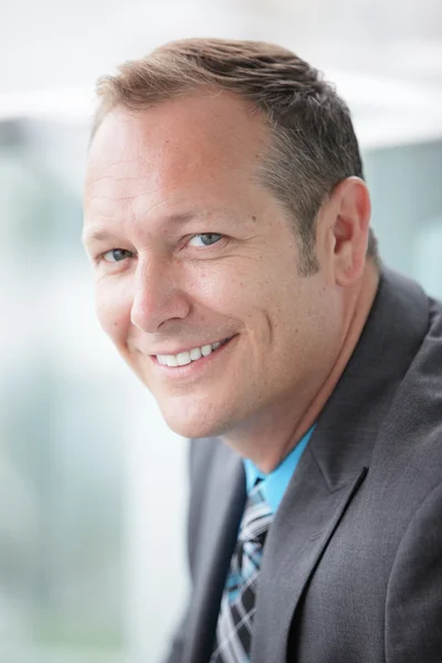 Stock image of a businessman smiling — Stock Photo, Image