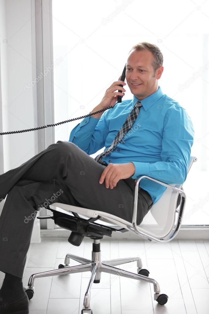 Stock image of a businessman on the phone