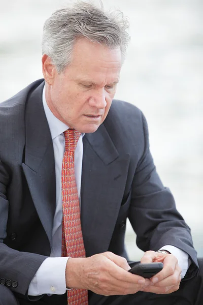 Businessmen sending a text message — Stock Photo, Image