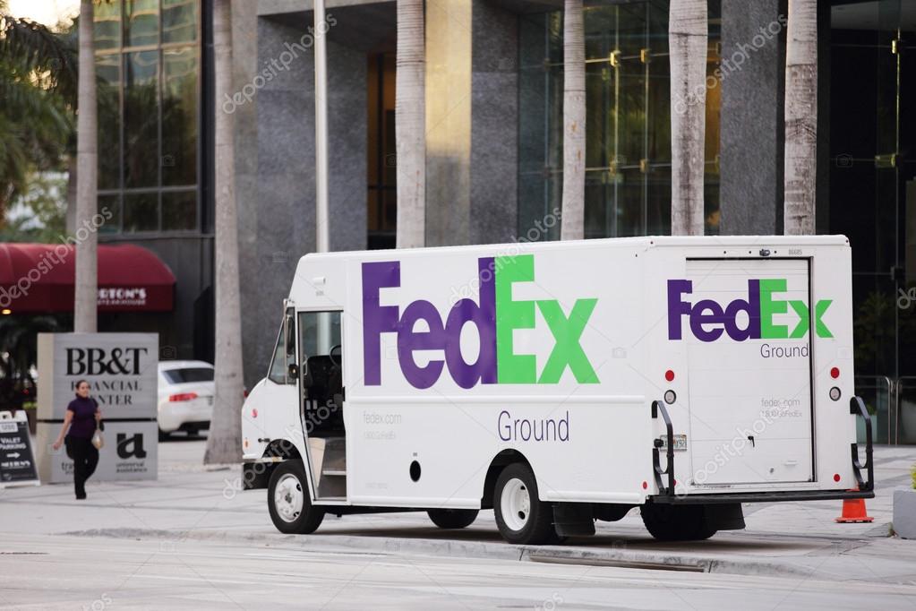 Brickell Florida USA: FEBRUARY 22, 2014 - a Fedex Truck making a delivery at a business building at Brickell Miami Florida USA.