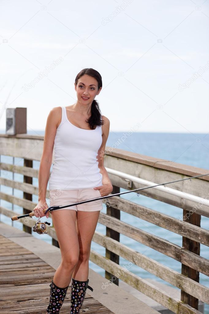 Woman posing with her fishing pole