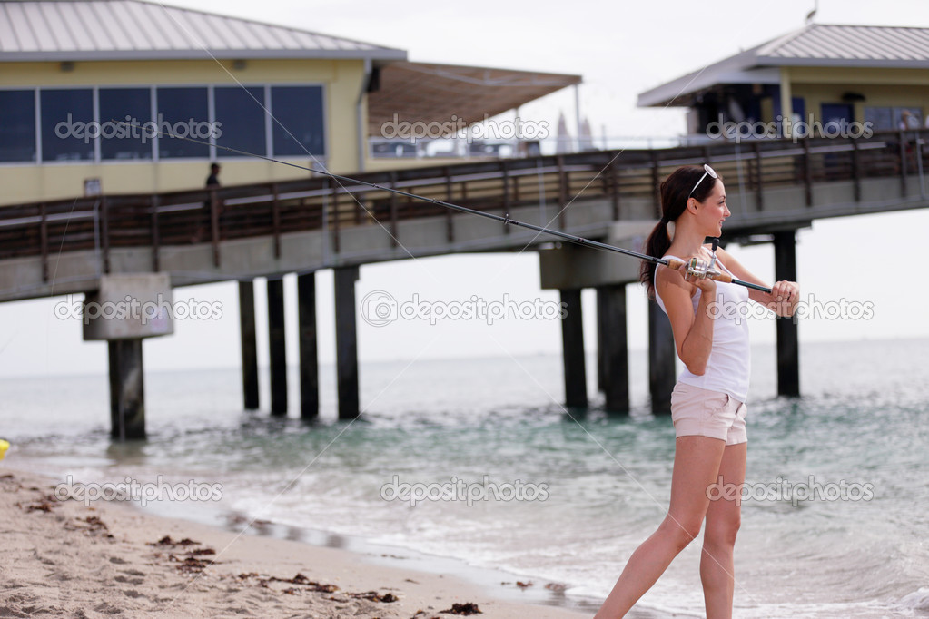 Woman casting her fishing pole