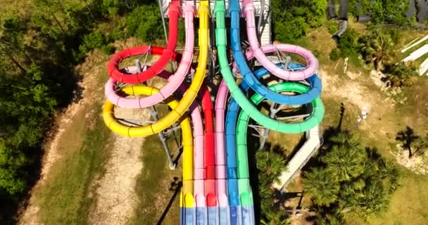 Aerial Pull Out Reveal Colorful Water Park Slide Tubes — Stock Video