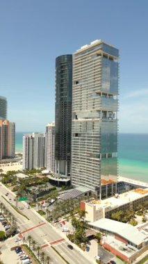 Vertical drone footage Porsche Design Tower and Turnberry Ocean Club Residences Sunny Isles Beach FL