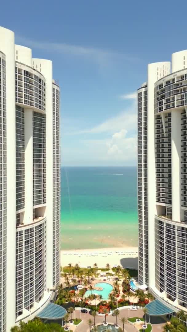 Vertical Aerial Drone Flying Buildings Reveal Beach Ocean — Stockvideo