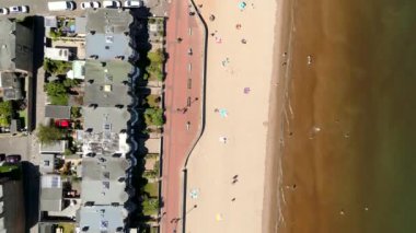 High aerial shot person riding bike by the beach
