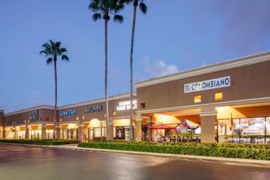 Coral Springs, FL, USA - August 7, 2022: Night photo of businesses at RK Coral Palm Plaza FL USA