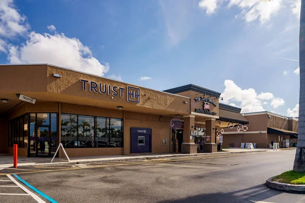 Hallandale Beach, FL, USA - July 31, 2022: Photo of Truist Bank and The Juicy Seafood Hallandale Beach FL