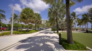 Sidewalk pov bike ride Pompano Beach Boulevard. 4k gimbal stabilized motion video