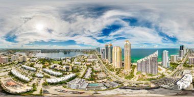 Aerial drone 360 photo Sunny Isles Beach highrise condominiums on the ocean USA