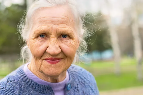 Portrait smiling elderly woman — Stock Photo, Image