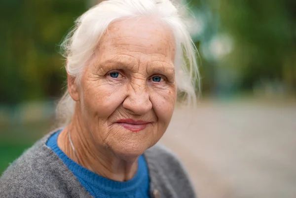 Smiling elderly woman — Stock Photo, Image