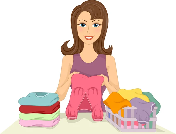Dziewczyna składanie ubrania — Zdjęcie stockowe