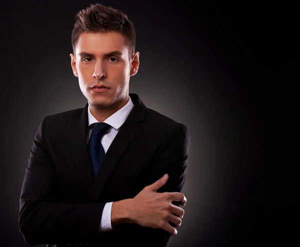 Young business man posing with folded arms — Stock Photo, Image