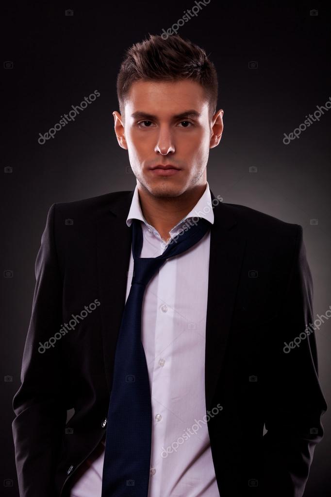 Loose tie | Young businessman with loose tie — Stock Photo © feedough ...