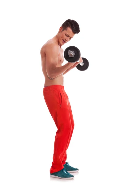 Young man performing a bicep curl — Stock Photo, Image