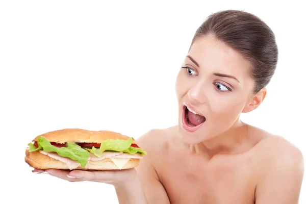Jovem mulher surpreendido por seu sanduíche — Fotografia de Stock
