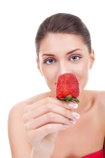 Young woman showing a strawberry Royalty Free Stock Photos