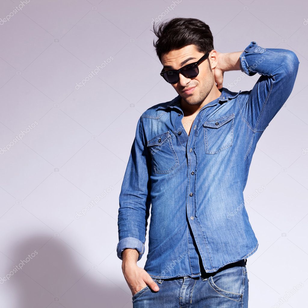 Fashion man wearing sunglasses thinking