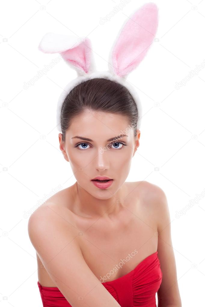 young woman in red dress wearing rabbit ears